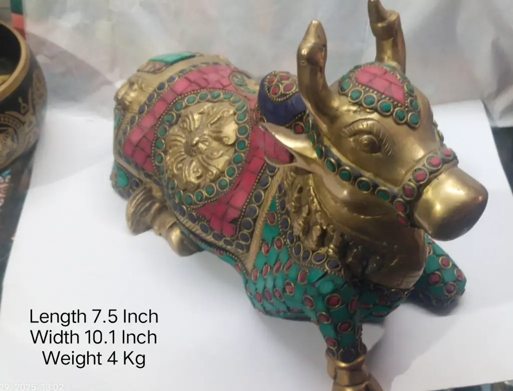 Statue Of Nandi Made Up Of Brass Have Stone Work On It And Have A Weight Of 4000 Grams. A Home Decore Item.